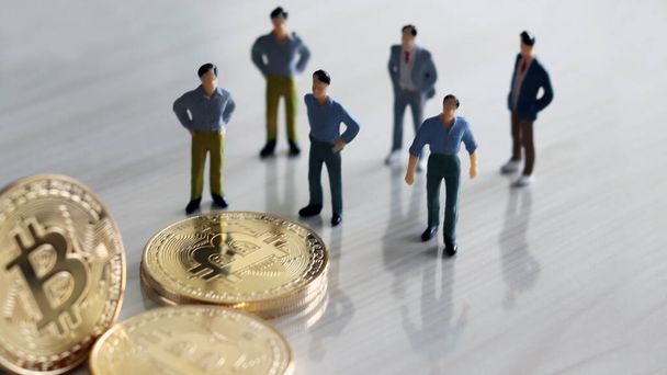 Miniature people and bitcoin. - Foto, Imagen