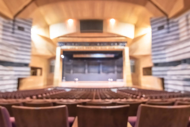 Theatre play,  opera music concert hall, performing arts entertainment show or auditorium blur background with blurry stage for drama act performance, and empty audience seat in large room interior - Photo, Image