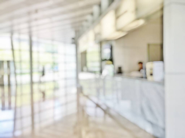 Business office lobby blur background of bank reception hall customer or patient counter service and cashier desk inside blurry hospital, office or hotel waiting hall with glass wall window - Photo, Image
