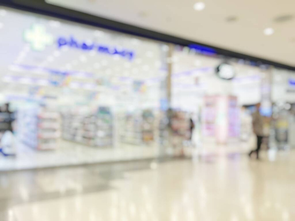 Pharmacy store or drugstore blur background with drug shelf and blurry pharmaceutical products, cosmetic and medication supplies on shelves inside retail shop interior - Photo, Image