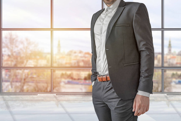 Man in elegant custom tailored expensive suit with open jacket in the office - Photo, Image