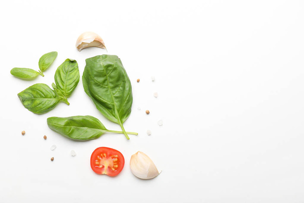 Composition with basil, tomatoes and spices on white background - Photo, Image