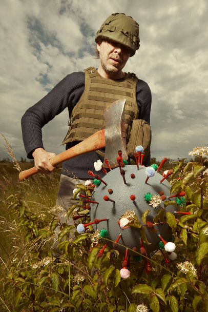 Man in style of territorial army catching virion of coronavirus - Foto, Imagem