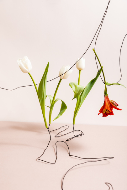 floral composition with white tulips and red Alstroemeria on wires isolated on beige - Foto, Imagem