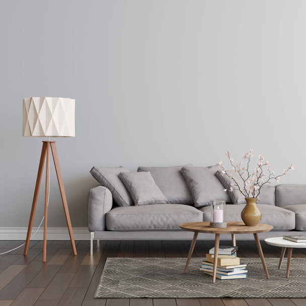 Living room interior with grey sofa, two coffee tables on the carpet and the floor lamp. Empty gray wall mockup. A pile of books on the carpet, a candle and flowers on the table. 3D render. 3D illustration. - 写真・画像