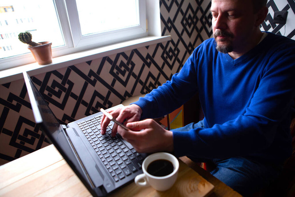 Adult man working at home. Freelance concept - Photo, Image