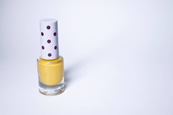 A bottle with blue nail polish on white background. nail lacquer. Nail manicure concept. Isolated, copy space - Foto, Bild