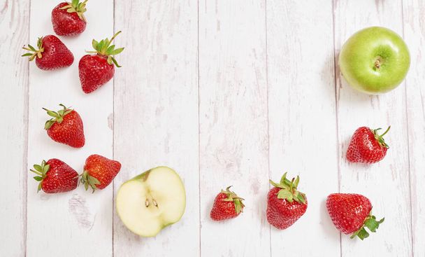 Detox concept. Tasty fruits and berries. Healthly food. Veganism, vegetarianism, raw food diet. Strawberries and apples. Summer fresh fruits. Copy space. Vitamins in food. Healthy breakfast. - Photo, Image