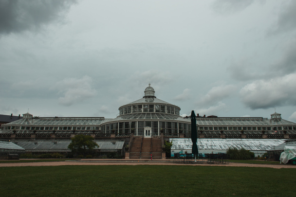 Facade of University of Copenhagen Botanical Garden with cloudy sky at background, Denmark  - Photo, Image