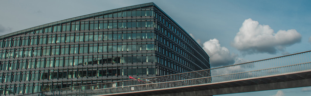 Panoramic crop of bridge near building and cloudy sky at background, Copenhagen, Denmark  - Photo, Image