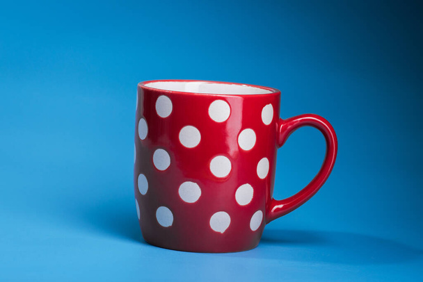 empty red coffee cup on a blue background - Photo, Image