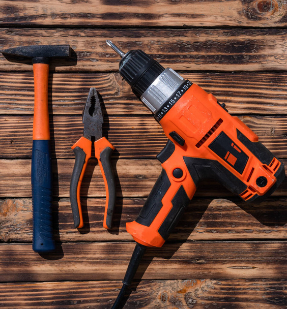 Tools for construction on a wooden background - Photo, Image