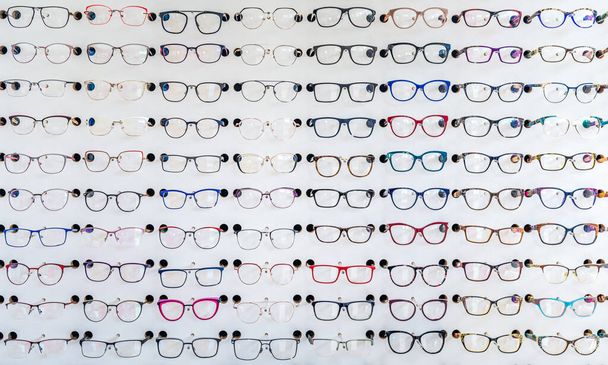 dioptric glasses on the shelf of an optometric clinic and glasses store - Foto, imagen