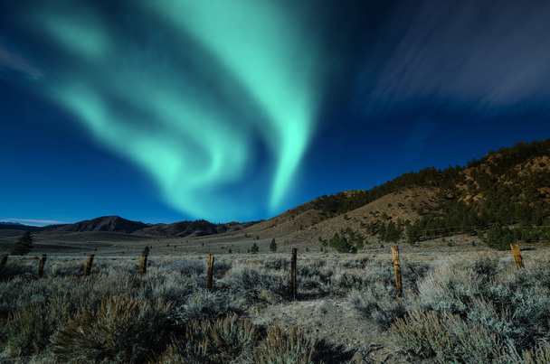 Green northern lights aurora borealis - Фото, изображение
