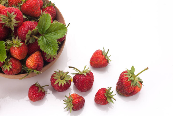 Red fresh strawberry in a bowl isolated on white background - Zdjęcie, obraz