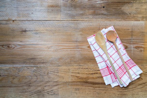 Kitchen towel background with wooden spoons - 写真・画像
