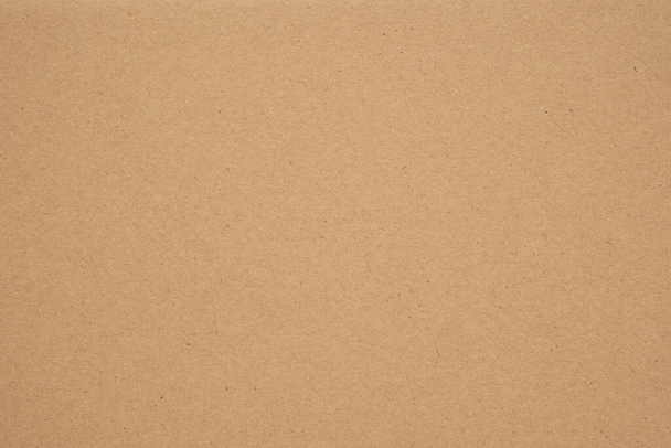 Textura de fondo de papel kraft o artesanal marrón, hoja de cartón, papel reciclado, espacio de copia para texto. - Foto, Imagen