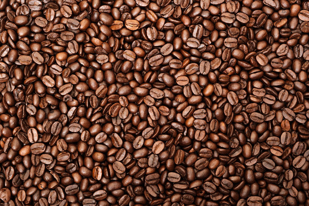 Widok góry brązowej palonej ziarna kawy, może być używany jako tło, kopiowanie miejsca na tekst. - Zdjęcie, obraz