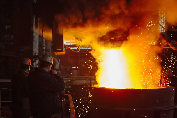 Steelmaker at ingot casting. Electric arc furnace shop. Metallurgy.  - Photo, Image