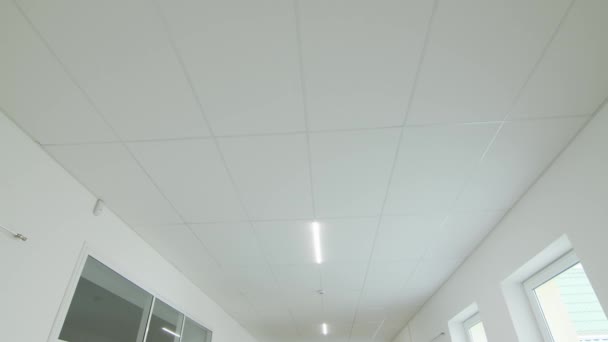 Camera movement and look up, white ceiling with lighting. POV - Footage, Video