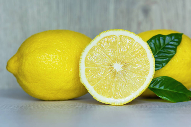 Fresh lemons on the kitchen table, background. - Foto, Imagem