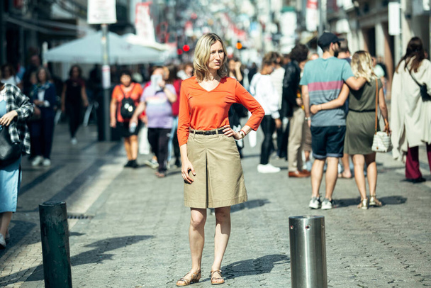A blond woman in posing standing on the street. Porto, Portugal. - Foto, afbeelding