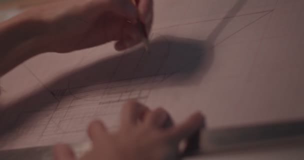 Close-up of woman architects hands drawing architecture blueprint at office - Filmati, video
