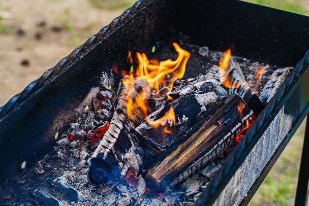 fire on coals in a grill for cooking kebabs  - Photo, image