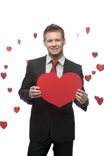 businessman holding big red heart - Foto, Bild
