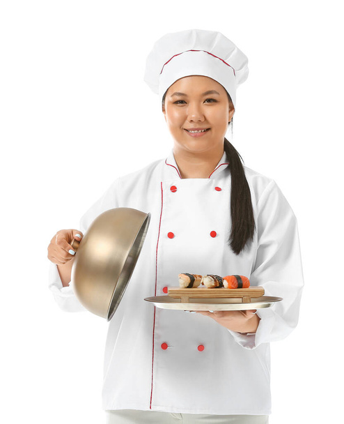 Beautiful Asian chef with sushi rolls on white background - Фото, изображение