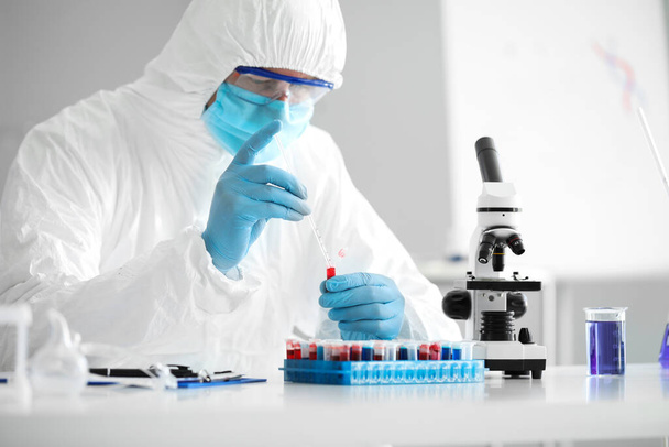 Scientist working with sample in laboratory - Photo, Image