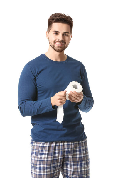 Young man with toilet paper on white background - Photo, Image