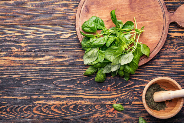 Composition with fresh basil on wooden table - Fotografie, Obrázek