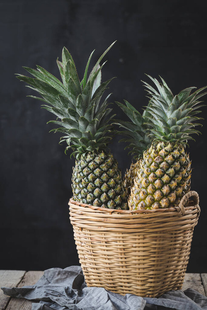 Fresh pineapples on the dark background - Photo, Image