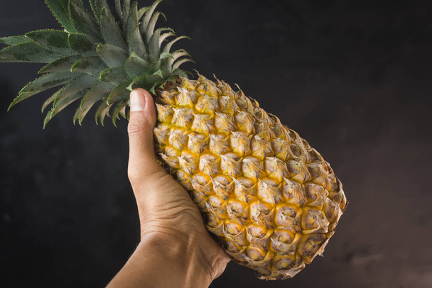 Fresh pineapples on the dark background - Photo, Image