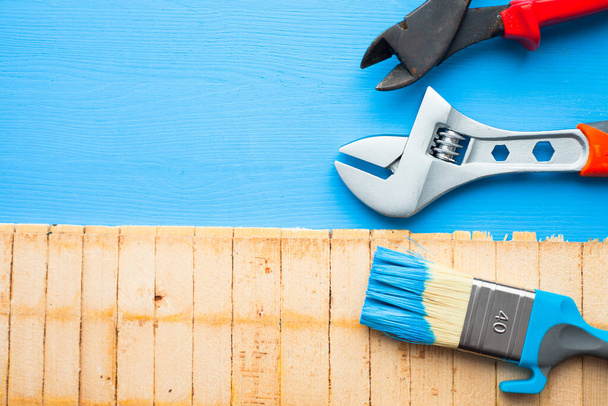 Construction and repair concept. Set of tools for renovation on the wooden background. Top view. Space for a text. Flat lay. Close up. - Foto, Imagen