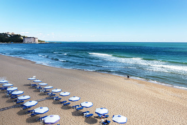Varna, Bulgaria - September 21, 2019: end of the beach season on the Black Sea. Top view of the empty sandy beach, sea, waves. - Photo, Image