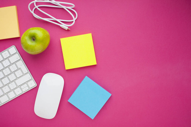 Set of colorful stickers, white keyboard, notebook and snacks. Office table, desk with different objects. Working process. Education, business concept. - Foto, imagen