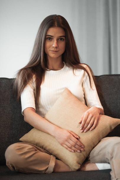 Young woman pretty relaxing on couch in living room. Casual style indoor shoot - Photo, Image