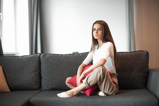 Young woman pretty relaxing on couch in living room. Casual style indoor shoot - Photo, image