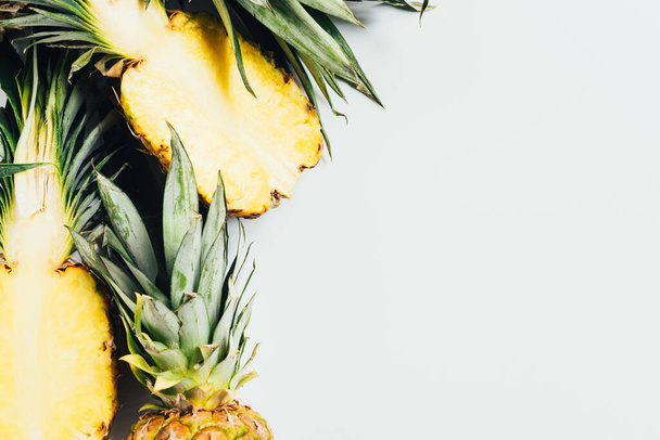 top view of cut juicy pineapples on white background - Φωτογραφία, εικόνα