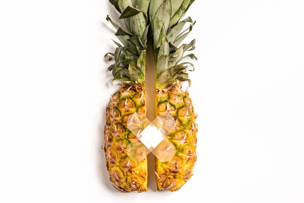 top view of cut ripe pineapple with patch on white background - Foto, Imagem