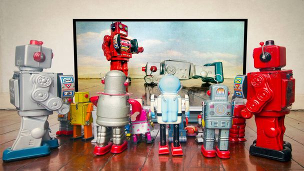 retro robots watch the News about police brutality  - Photo, Image
