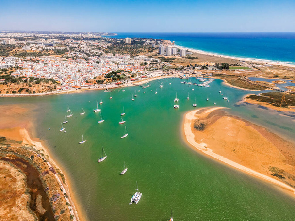 Aerial view of bay with yachts and city of Alvor, Algarve, Portugal - Foto, Imagen