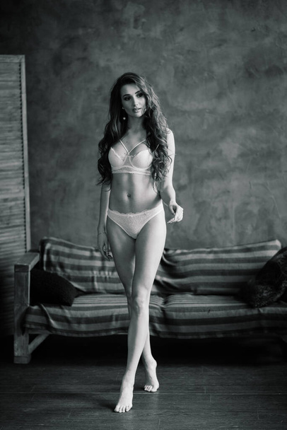 Foto de Beautiful, seductive woman posing in sexy white underpants