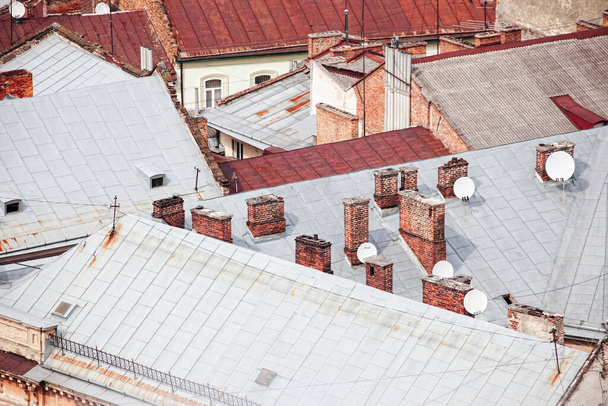 Top view on the roofs of old brick houses. - Фото, зображення