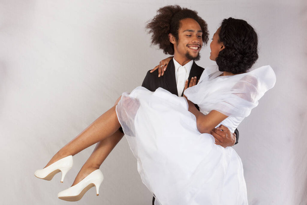 Romantic Black couple with him holding her - Foto, afbeelding