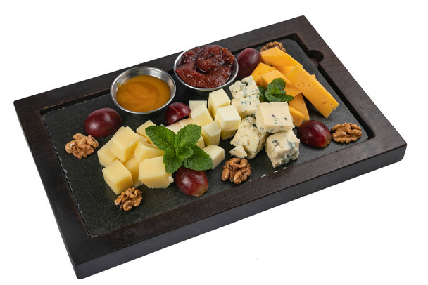 assorted cheese on a tray on a white isolated background - Zdjęcie, obraz