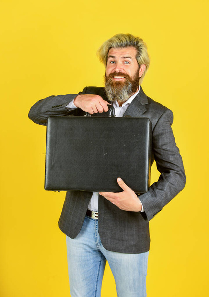 happy and successful man hold money case. bearded man show office briefcase. good business deal. successful business concept. rich man with beard. live in luxury. bag with money - Fotoğraf, Görsel
