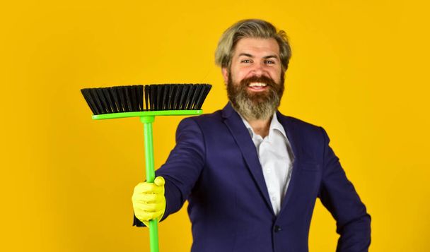 bearded man cleaning with mop. Janitor in gloves. husband cleaning house. Housework and domestic duty. Male janitor with cleaning supply. sweeping the floor. businessman cleaner. Not fair - Photo, Image